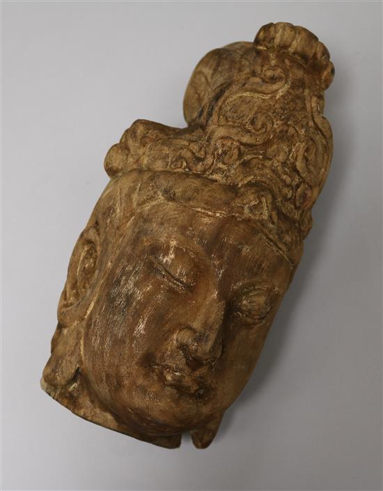 A carved wood Guanyin head height 25cm